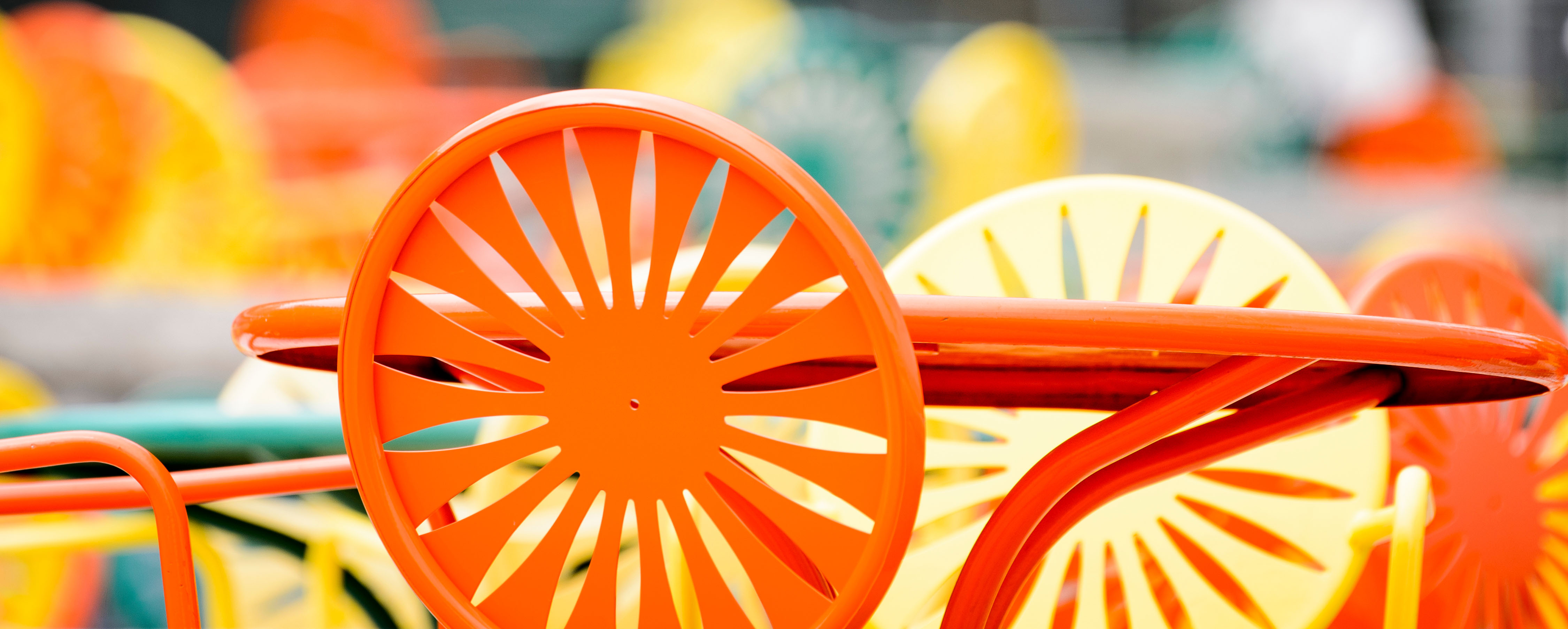 Chairs featuring an iconic sunburst pattern populate the Memorial Union Terrace at the University of Wisconsin-Madison.
