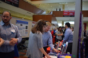 Participants take a look at a vendor partner's handouts.