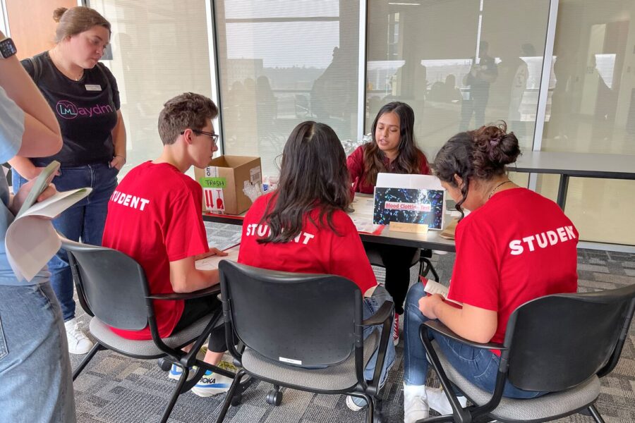 students at table doing activity