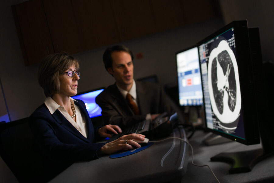 Researchers working at the computer