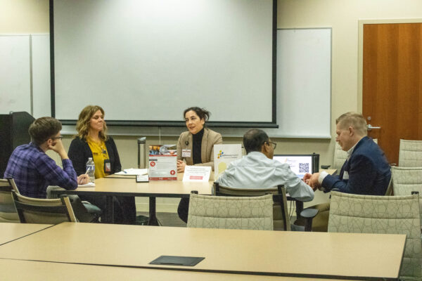 group of researchers at roundtable discussion